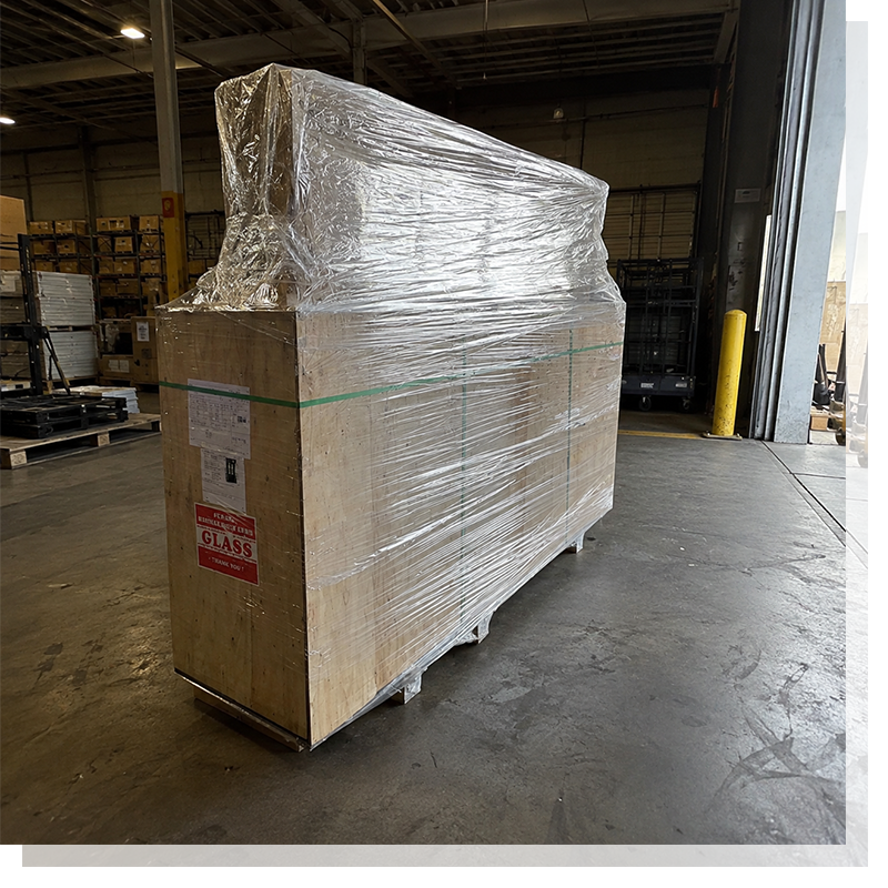 Wrapped wooden shipping crate in a factory