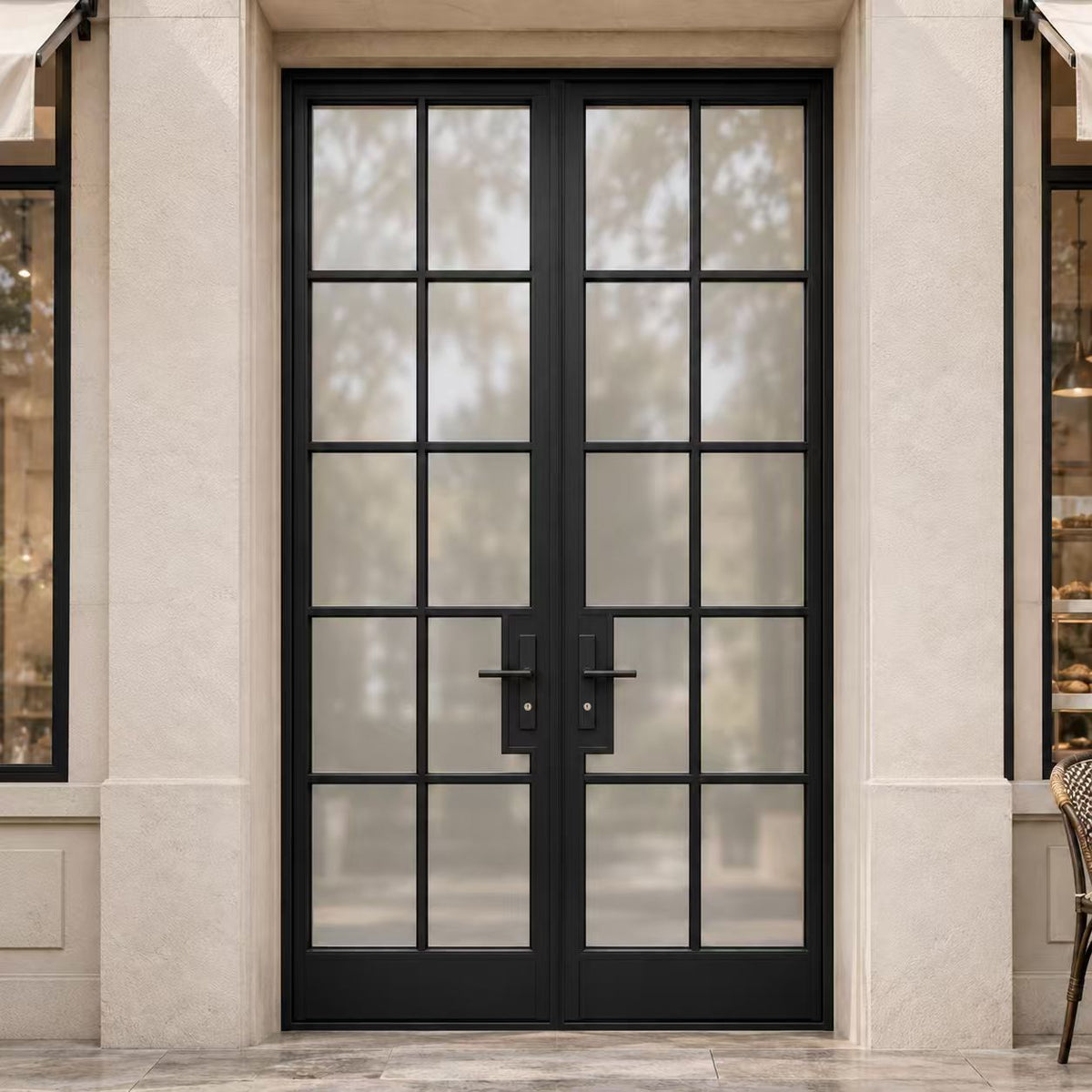 Black double iron French entry doors with divided glass panels at an upscale residential entrance