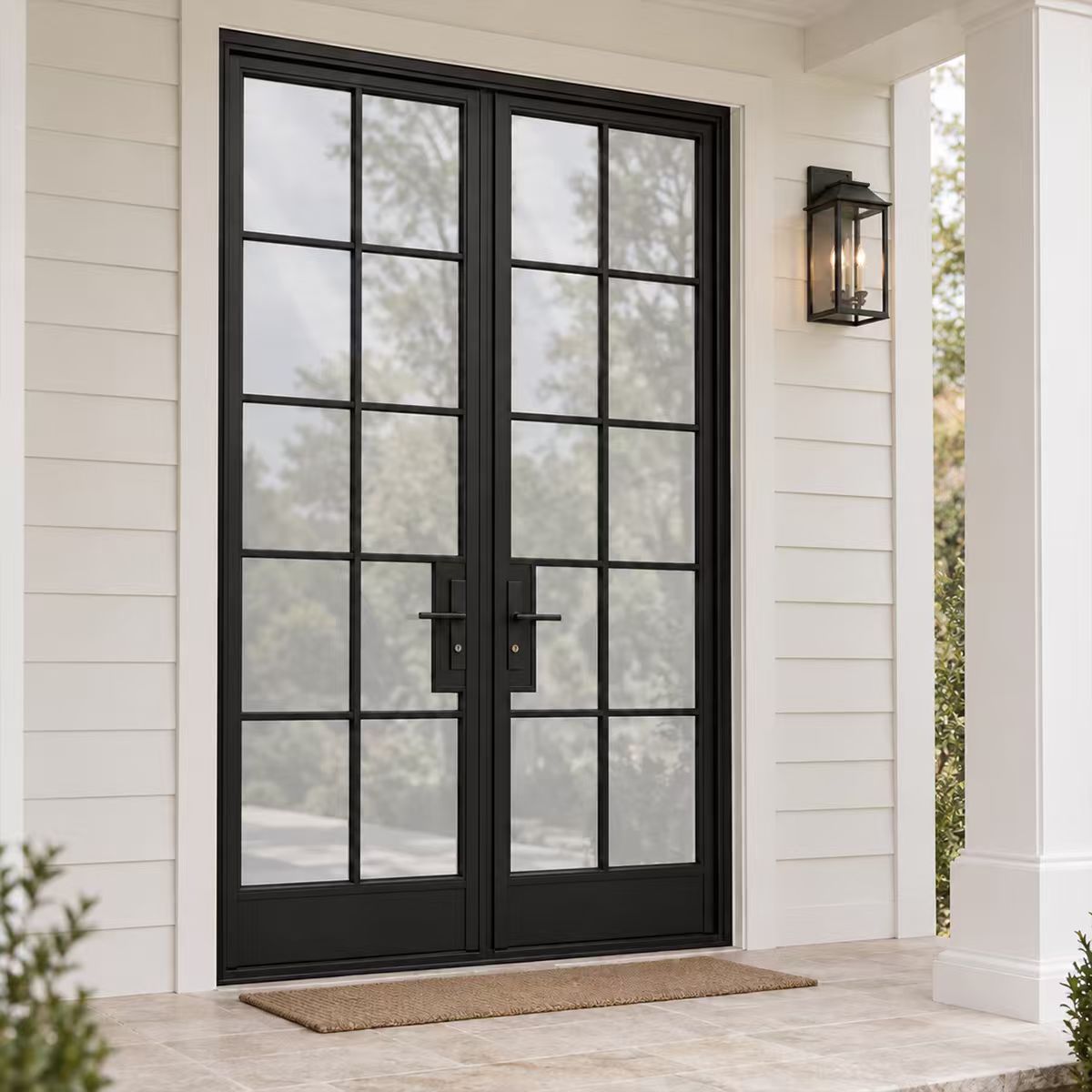 Angled exterior view of contemporary black iron French entry doors with tall divided glass panels