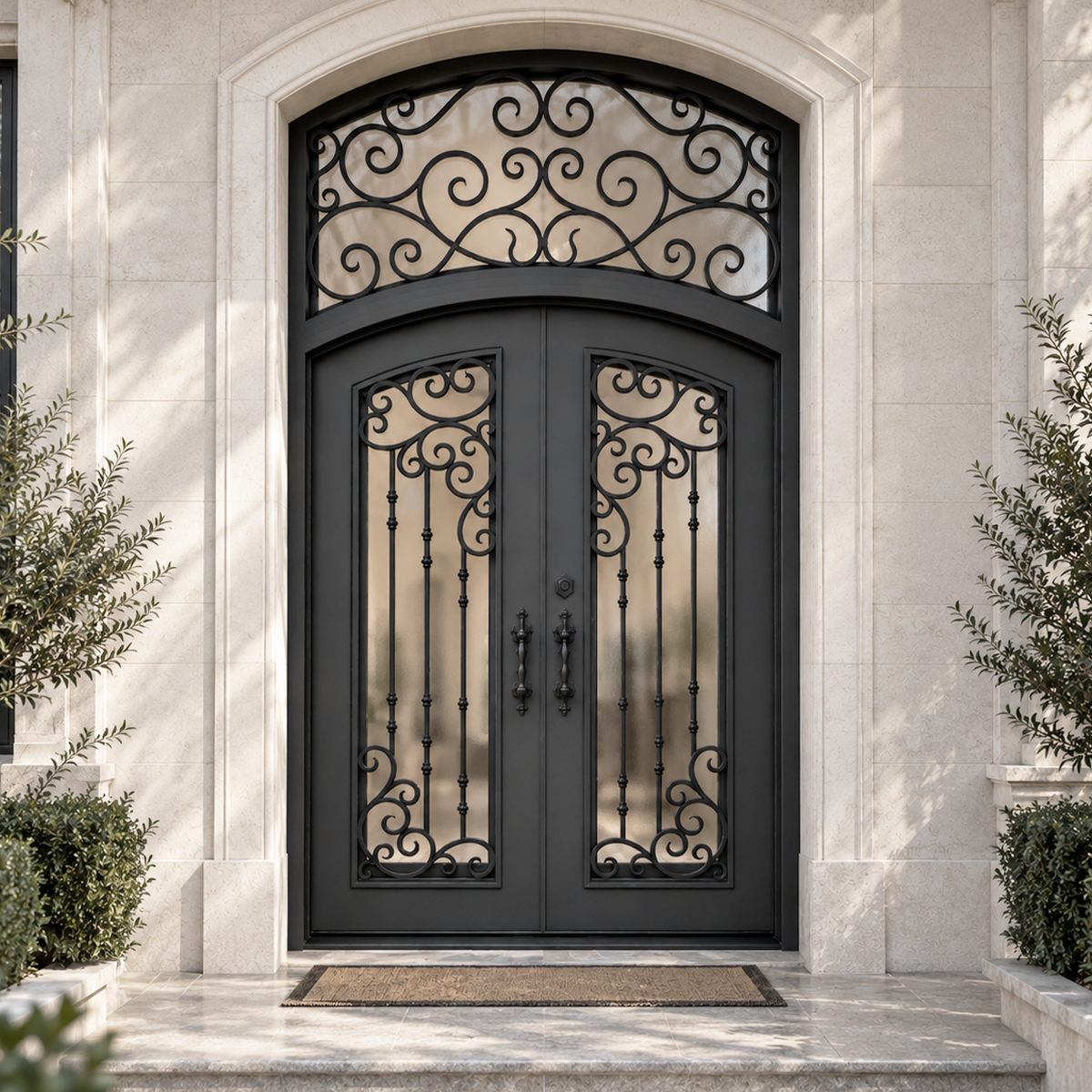 Decorative black iron front door with scrollwork glass, double door design and arched transom in a stone entryway