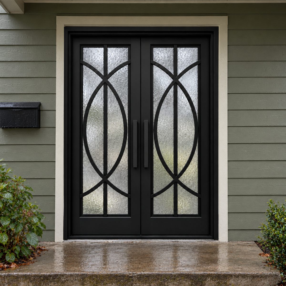 Black double modern iron doors with intersecting curved ironwork and textured glass at a green-sided entrance