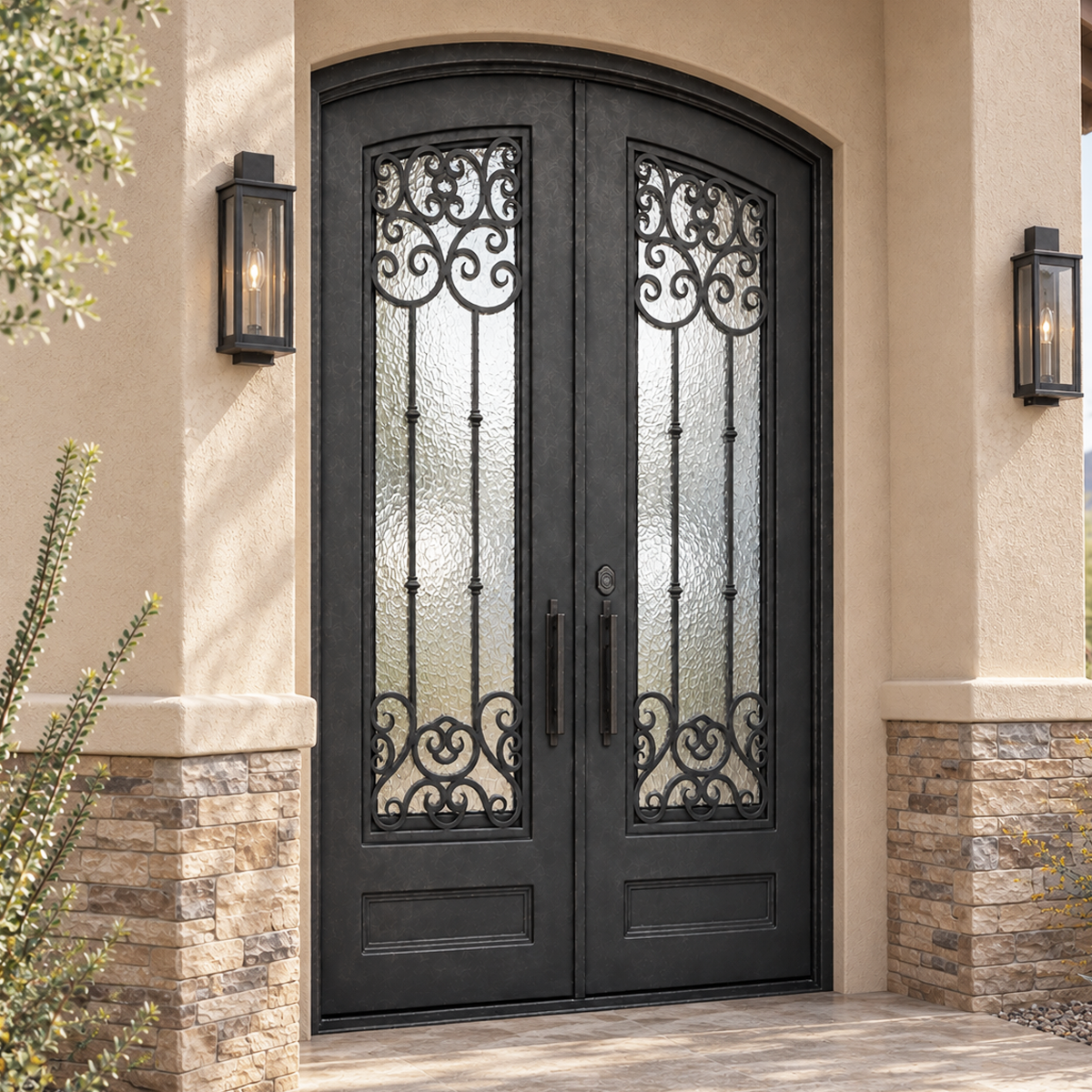 Southwestern American home entrance with arched double iron door, textured glass and ornamental scrollwork